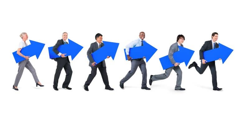 Different people carrying blue arrows pointing upwards.