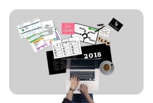 Charts, plans, calendar, laptop...all tools to help you prepare for the start of your moving business.