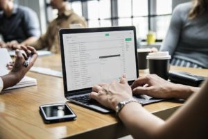 Person checking email on laptop - one or more of those could be from your business.