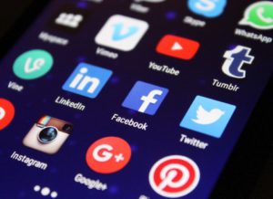 Social media icons on a phone.
