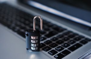 Lock key with digits on a keyboard - secure your WordPress website starting from the login.