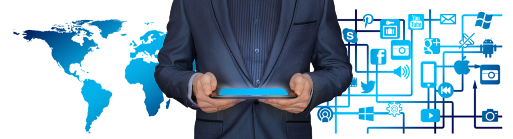 Businessman holding a tablet, world on one side and network on other.