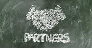 Drawn handshake on blackboard.