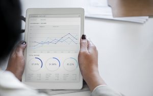 Woman looking at SEO growth chart.