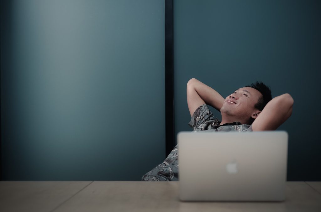happy man with a laptop