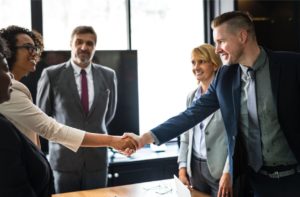shaking hands after attending industry conferences