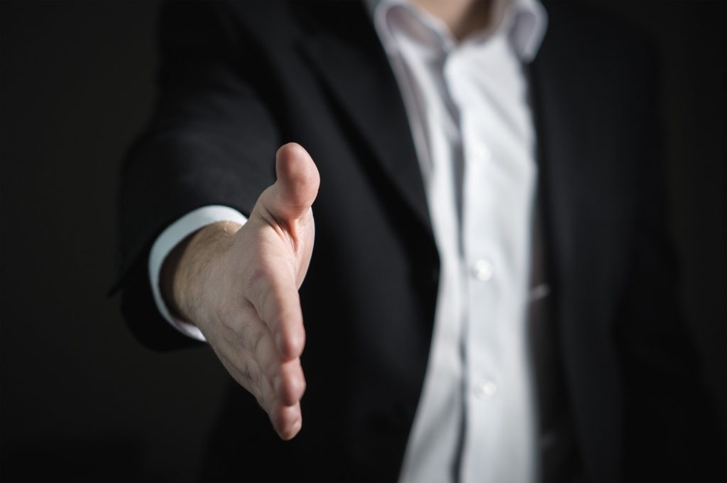 A person offering a handshake
