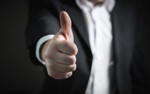 a person showing a thumb up