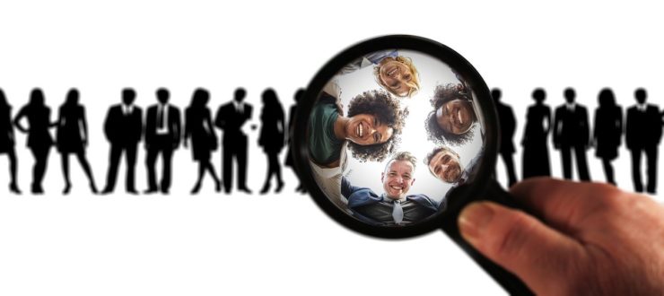 People under magnifying glass