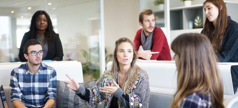 A business owner instructing her employees.