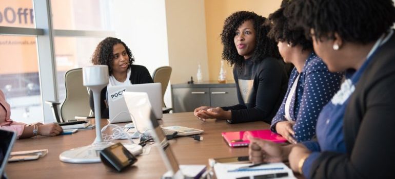 Women discussing keyword strategy
