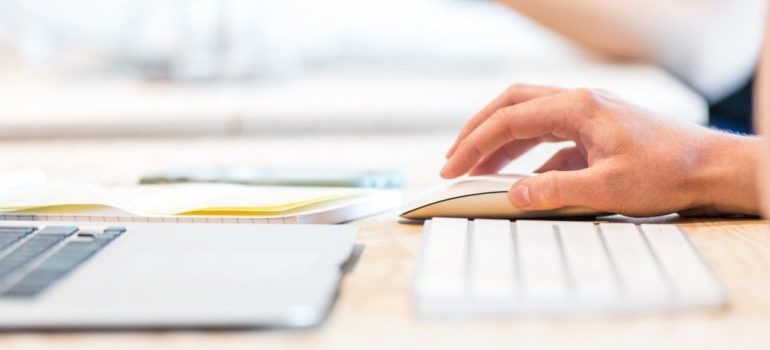 Person clicking on mouse