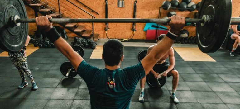 person lifting barbell