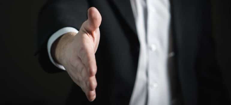 A close-up of a man's extended hand.