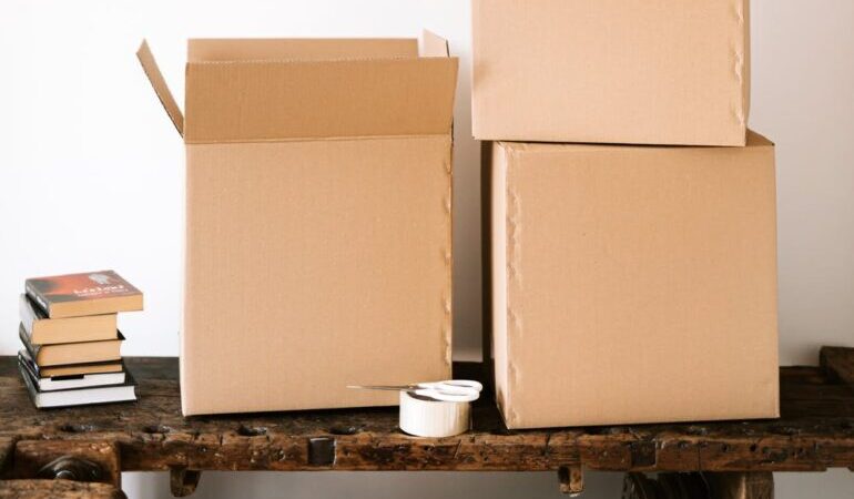 Cardboard boxes on a wooden table.