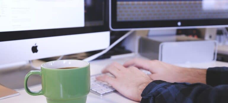 Person responding to an email.