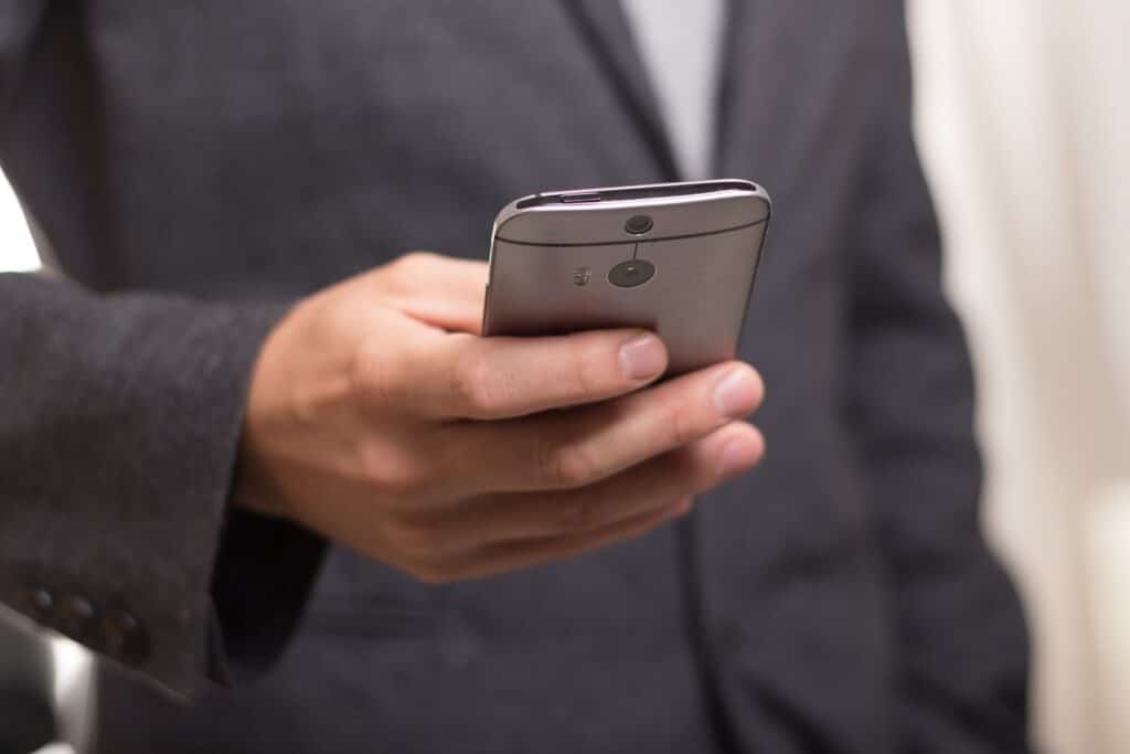 A person holding a mobile phone