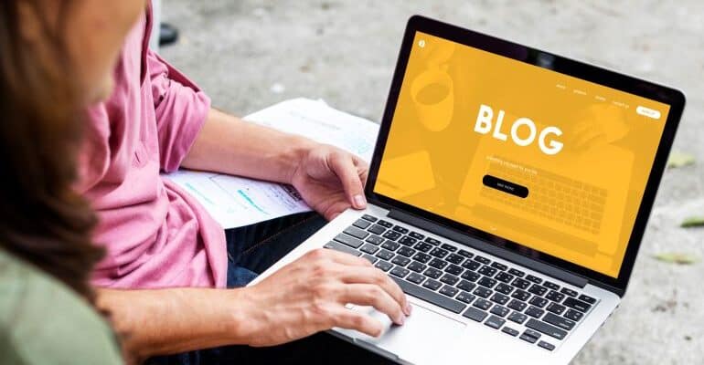 Blog page on laptop screen.
