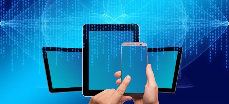 A person using different devices to read online content.