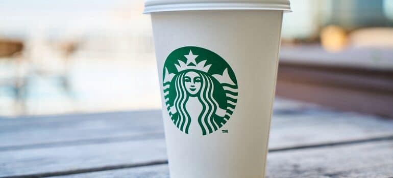 Starbuck cup with Starbucks logo.
