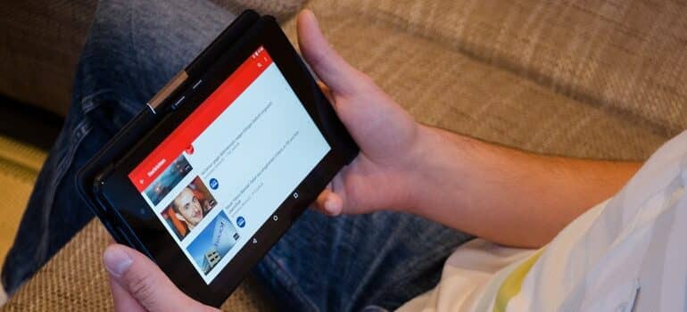 Person reading the news on a tablet.