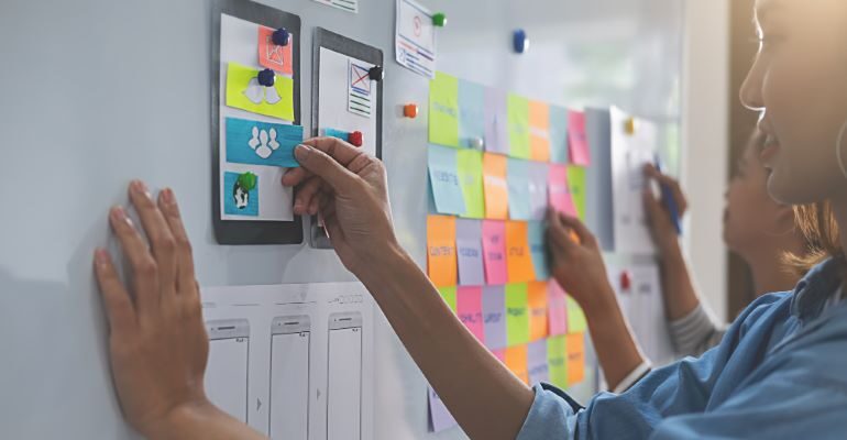 Designer drawing out the layout of their website - The most important rules of UI design