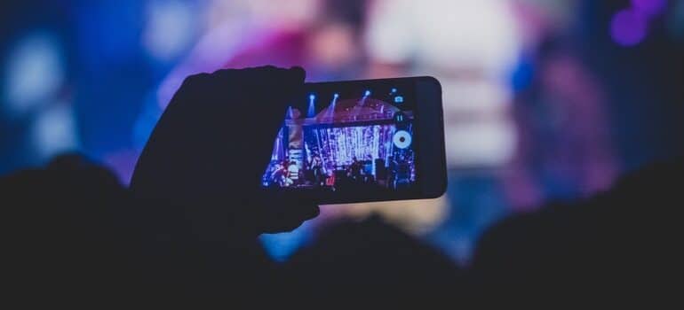 A person creating engaging Instagram ads on a phone. 