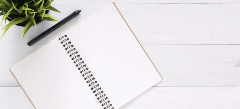 Notebook and pen on a desk.
