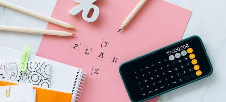 Calculator and paper on desk.
