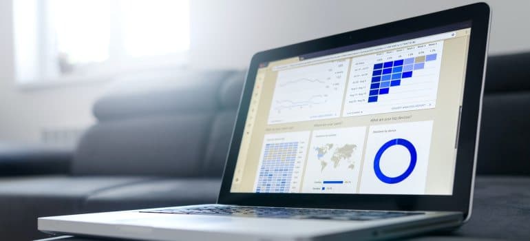 A laptop with marketing data on the screen.