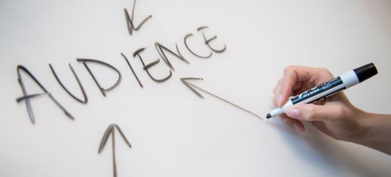 The word AUDIENCE written on whiteboard.
