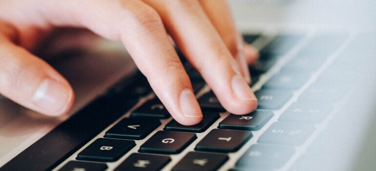 person typing on a keyboard