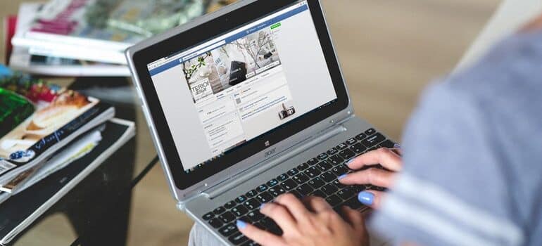 Person scrolling through Facebook.