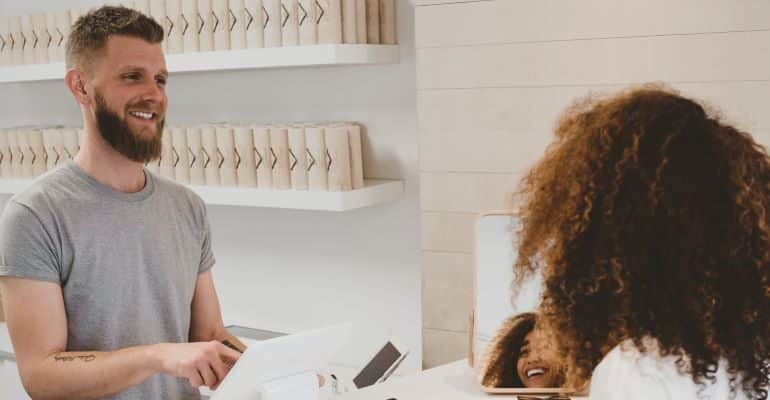 Pleasant talk between client and sales representative.