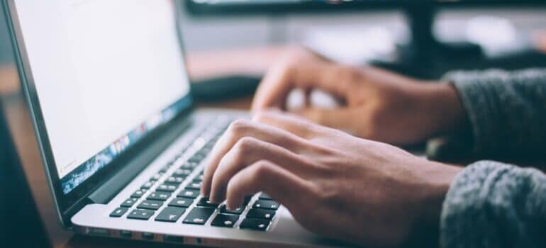 A man creating a landing page to enable using remarketing tactics to get more leads.