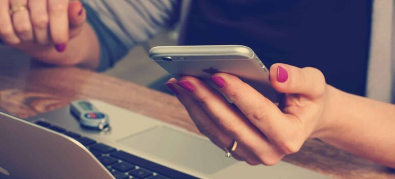 A person completing a form on their phone.