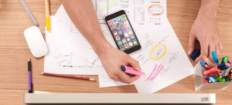 A man sketching out a strategy on using tools for automating your moving business
