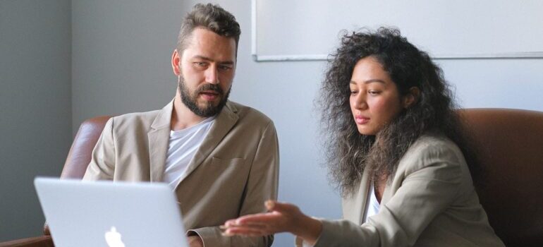 Two people are looking online about the importance of blogs for SEO