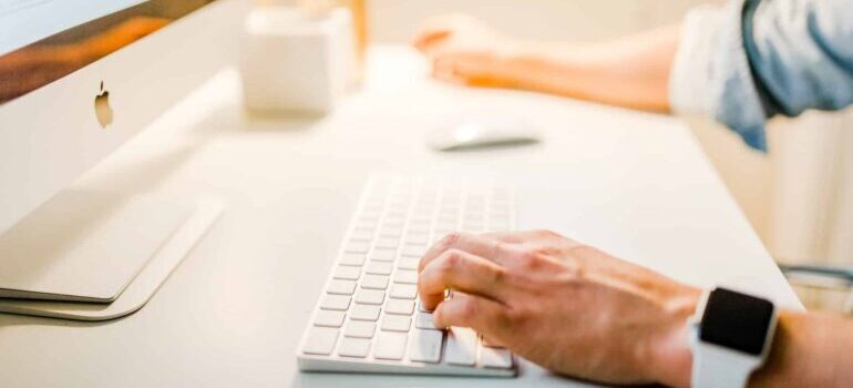 A person adjusting bids using his computer.