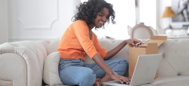 Woman leaving a review online after purchasing a product