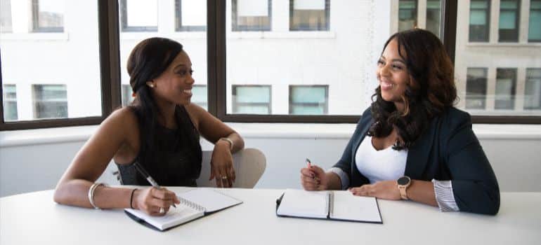 moving company owner in a sales meeting with a client
