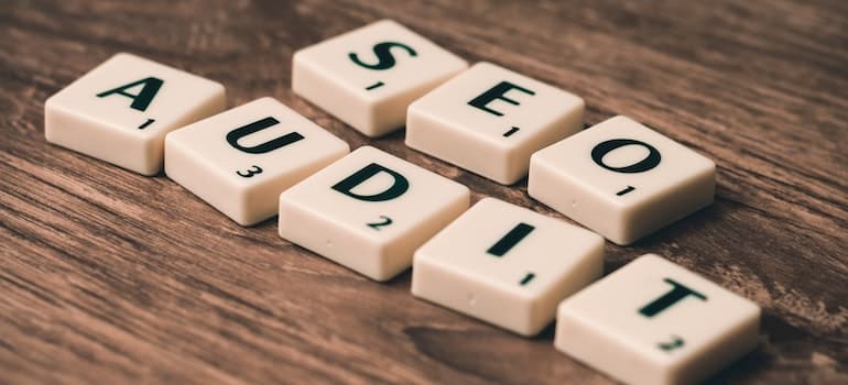 wooden blocks spelling SEO AUDIT