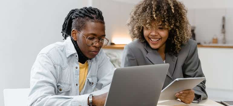 Two online marketing experts examining how SEO and content marketing impact your online moving quote visibility