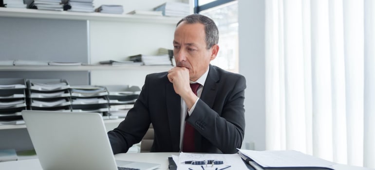a person looking at the computer