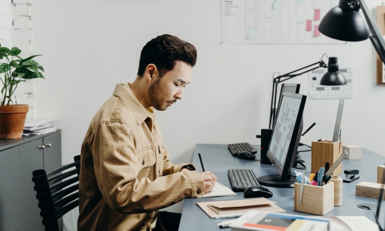 a man writing something down