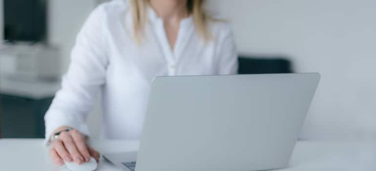 a woman by a computer