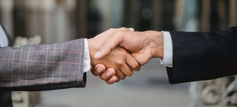 Two business partners shaking hands