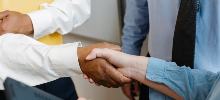 two people shaking hands