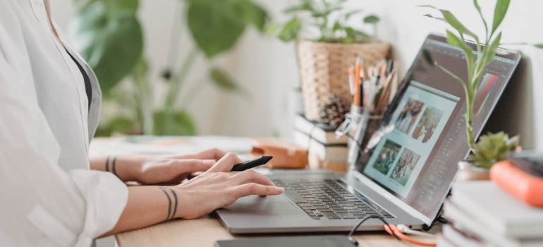 a person searching something on a laptop