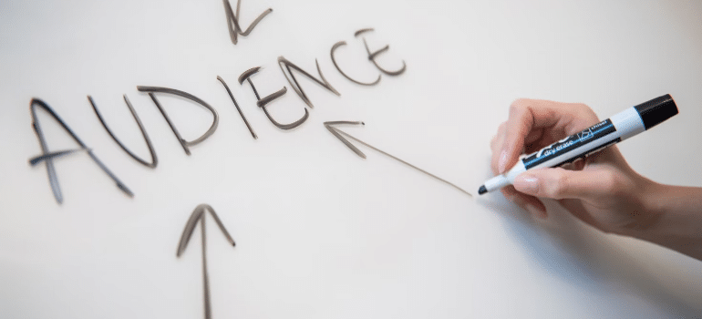 'Audience' written on a white board